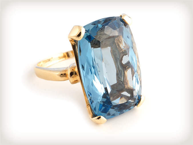 Image of 14K yellow gold ring with faceted aquamarine.