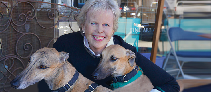 Image of Elizabeth Davidson and two greyhounds in front of The Ark.