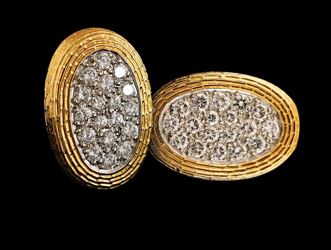 Image of Cartier Cufflinks feature 18K yellow gold ovals with diamonds,  circa 1971.