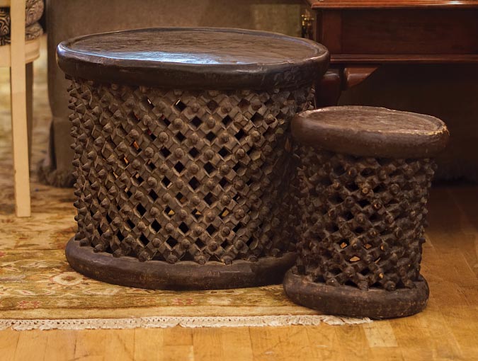 Image Of Large Bamileke Woodsmoke Stool, 24” Diam X 19”H And Small Bamileke Woodsmoke Stool, 13” Diam X 16”H.